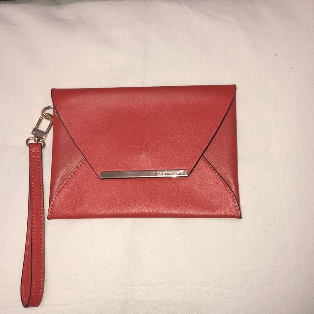 BCBG orange envelope wristlet.
